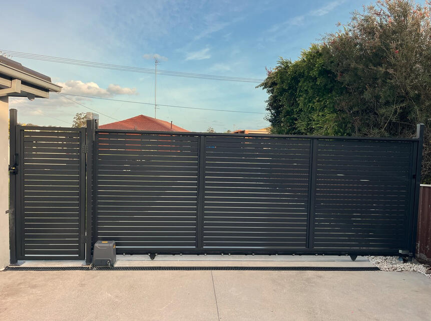 motorised aluminium slat sliding gate Monument colour installed in Berwick