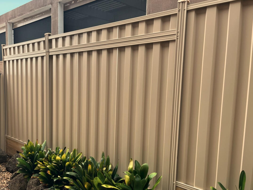 Colorbond Fence Extension Installation in Berwick Sliding gate and fence in black speartop design installed in Cranbourne North