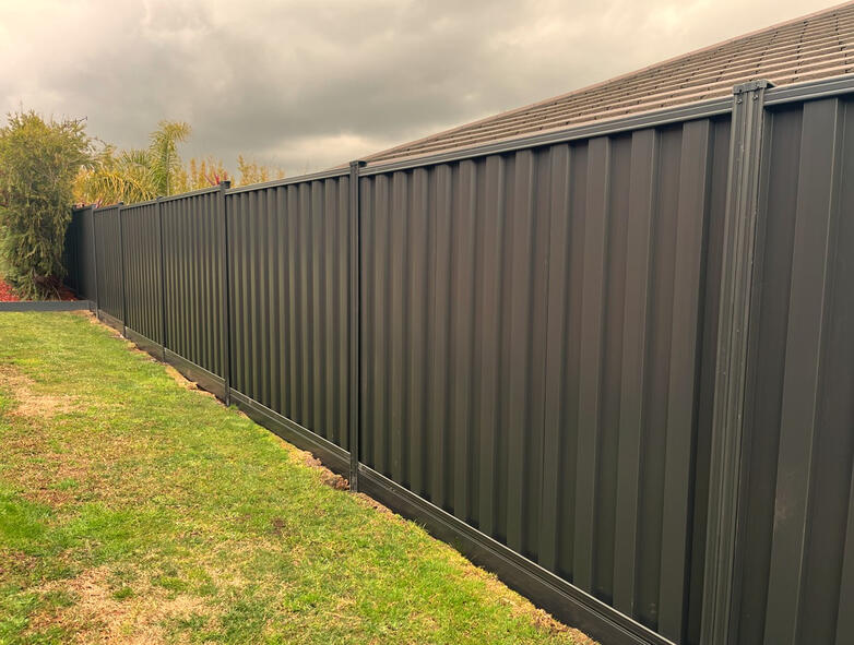 Sloped Colorbond Fence Installation in Beaconsfield sloped Colorbond fence with aluminium sleepers installed in Beaconsfield